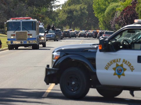 Law enforcement vehicles staged in Solvang, CA. on May 26, 2016 after a high speed pursuit of a driver suspected in the abduction of a 15-year-old girl in Southern California. 